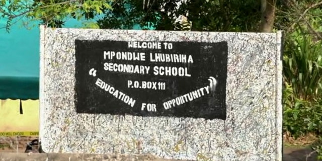 A sign of the Lhubiriha Secondary School in Mpondwe, Uganda