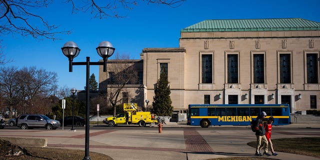 University of Michigan campus with a bus