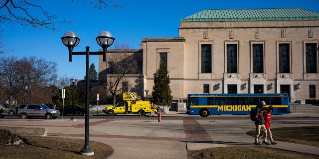 University of Michigan campus with a bus