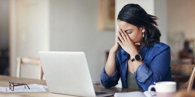 Upset woman on computer