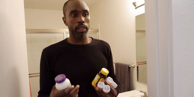man holding medication