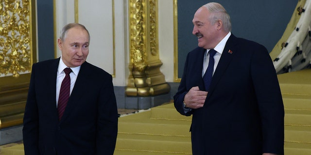 Russian President Vladimir Putin speaks with Belarusian President Alexander Lukashenko