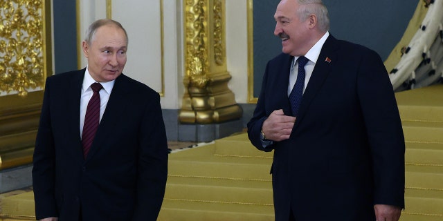 Russian President Vladimir Putin speaks with Belarusian President Alexander Lukashenko