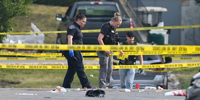 crime scene tape and police at the willowbrook shooting scene