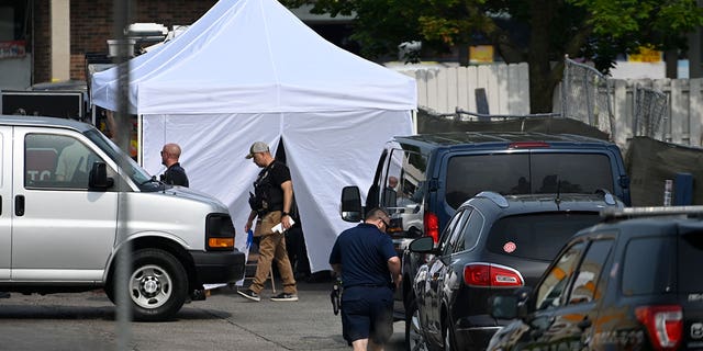 investigators set up tent by willowbrook shooting scene