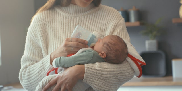 Woman feeding baby