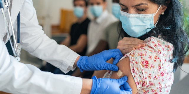 Woman getting vaccine