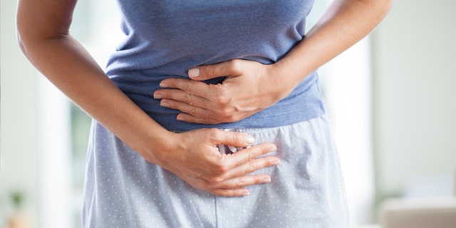 Woman with stomach pain