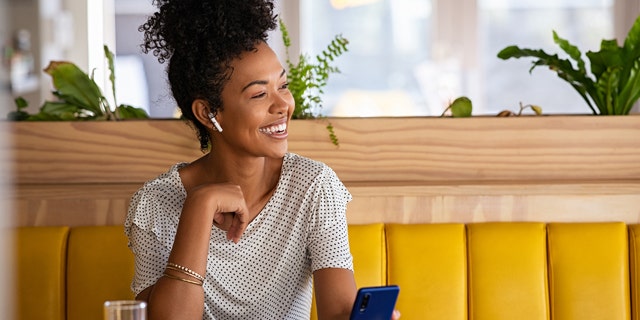 Woman wearing earbuds