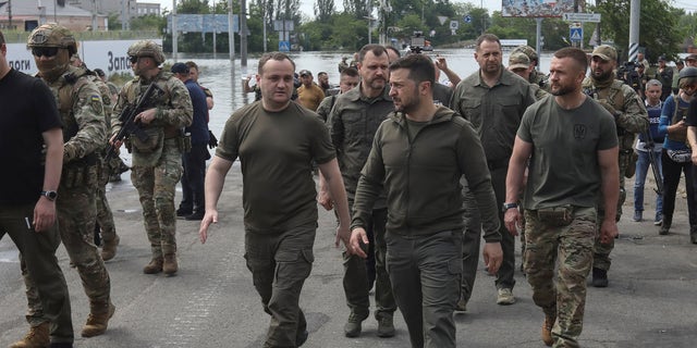 a photo of Volodomyr Zelenskyy walking through Kherson, Ukraine