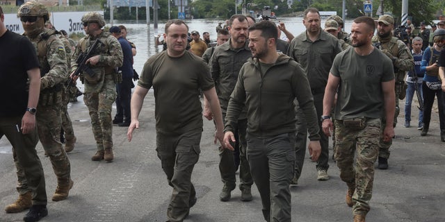 a photo of Volodomyr Zelenskyy walking through Kherson, Ukraine