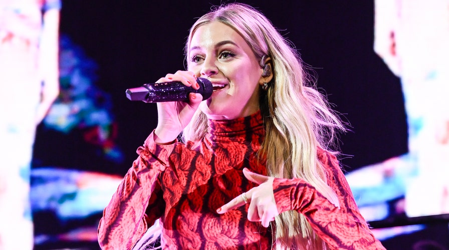 Kelsea Ballerini gets hit in the face with object thrown by fan at concert