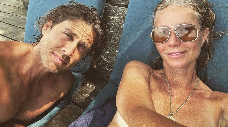 Gwyneth Paltrow sunbathes topless with husband Brad Falchuk while