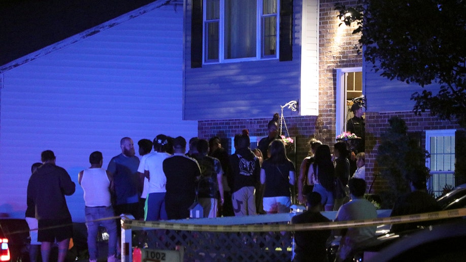 People in the front yard of a home