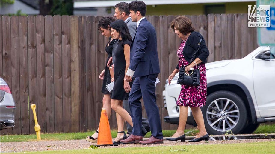The family of Cameron Robbins arrive to the memorial service