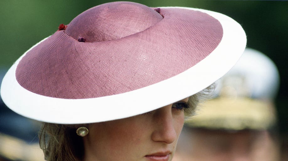 Princess Diana in a pink and white hat