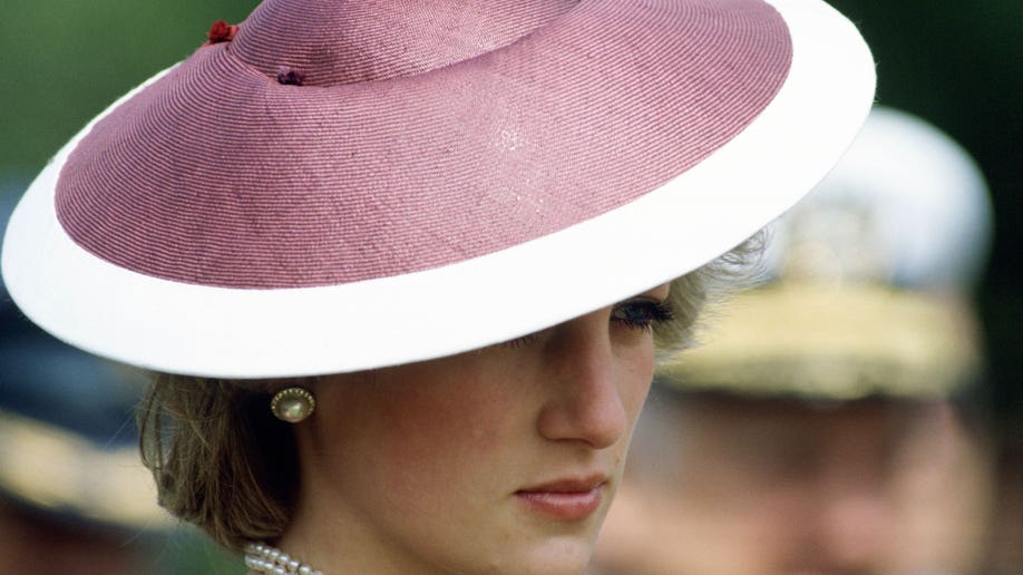 Princess Diana in a pink and white hat