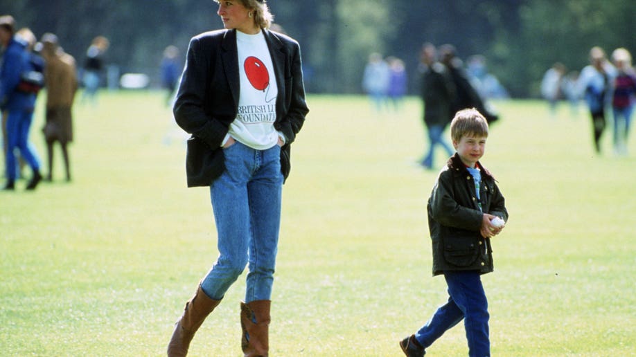 Princess Diana in jeans and a crewneck next to Prince Harry