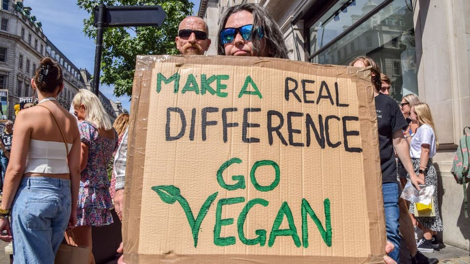 Woman holding a pro-vegan sign