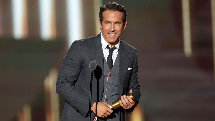 Ryan Reynolds accepts award on stage