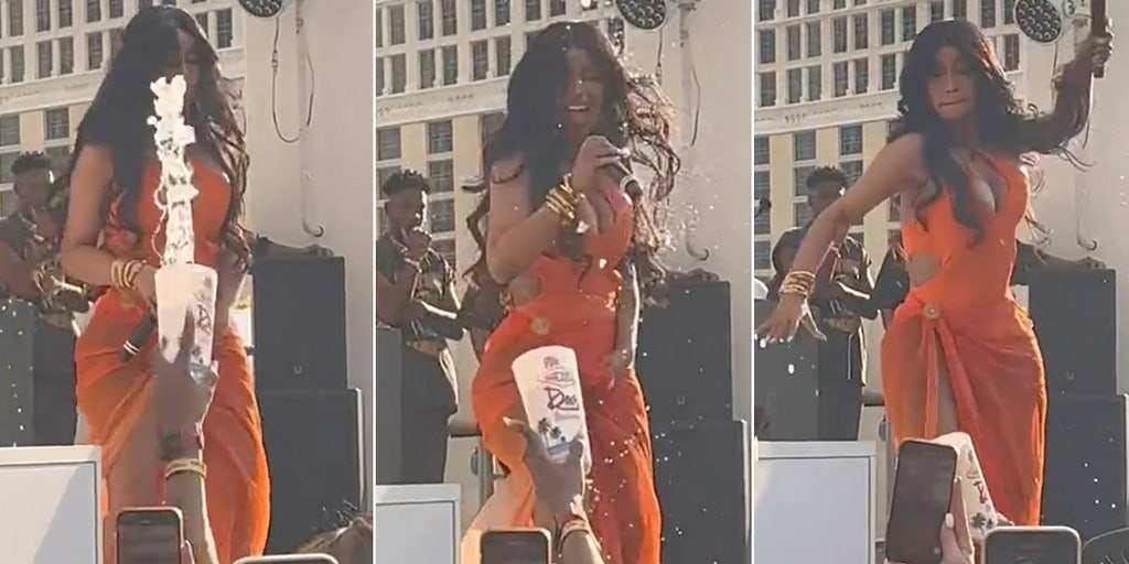 Cardi B hurls microphone at fan during Vegas concert after being splashed  by drink