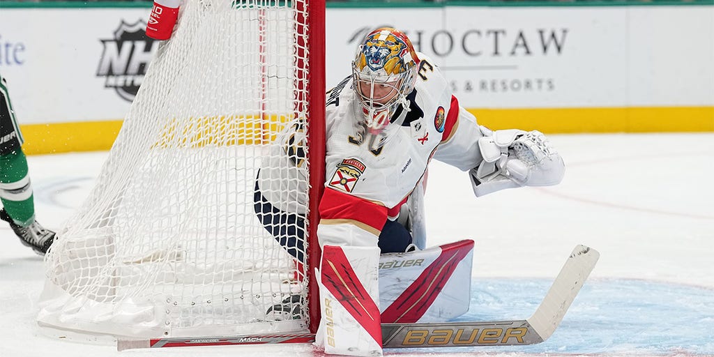 Florida Panthers goaltender Spencer Knight (30) wears a military