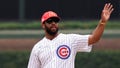 NASCAR driver Bubba Wallace throws the ceremonial first pitch of the game between the Chicago Cubs and the Cleveland Guardians at Wrigley Field on June 30, 2023 in Chicago, Illinois.