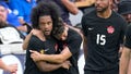 Canadas Jayden Nelson, left, celebrates with Jonathan Osorio, center, after scoring a goal against Cuba during the second half of a CONCACAF Gold Cup soccer match Tuesday, July 4, 2023, in Houston.