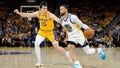 Stephen Curry #30 of the Golden State Warriors drives past Austin Reaves #15 of the Los Angeles Lakers during the fourth quarter in game five of the Western Conference Semifinal Playoffs at Chase Center on May 10, 2023 in San Francisco, California.