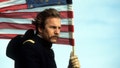 Kevin Costner carried an American flag in a still from "Dances With Wolves."