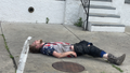 Kensington, Philadelphia: A man lays unconscious on the sidewalk moments before paramedics arrive on the scene.