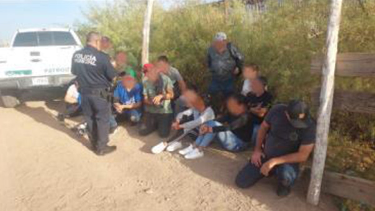 Illegal immigrants detained near the cloned truck at the border
