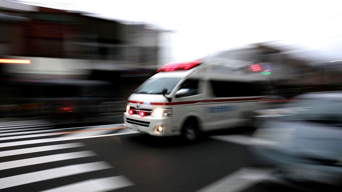 An ambulance drives through traffic in Osaka, Japan, October 24, 2017. 