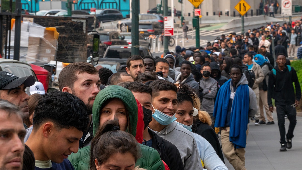 line of migrants in New York City