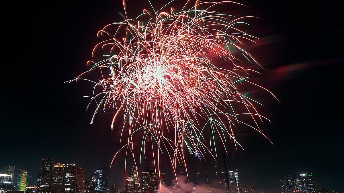 Fireworks explode during Boston Harborfest's Fourth of July weekend celebrations.