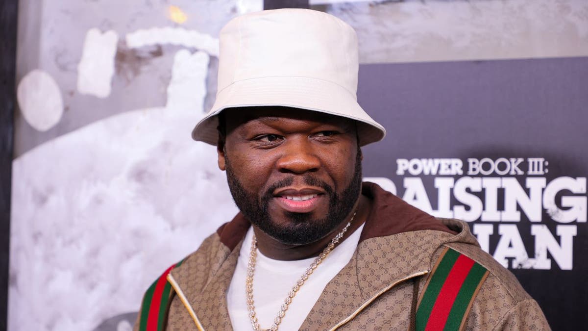 50 Cent wearing white hat