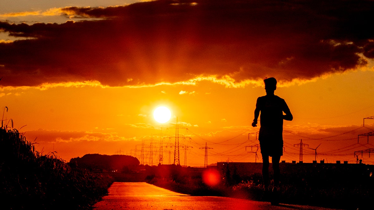 A man runs along a small road 