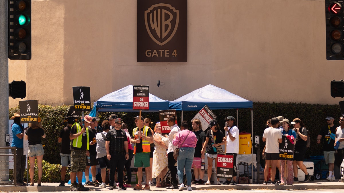 Hollywood writers actors strike Warner Bros