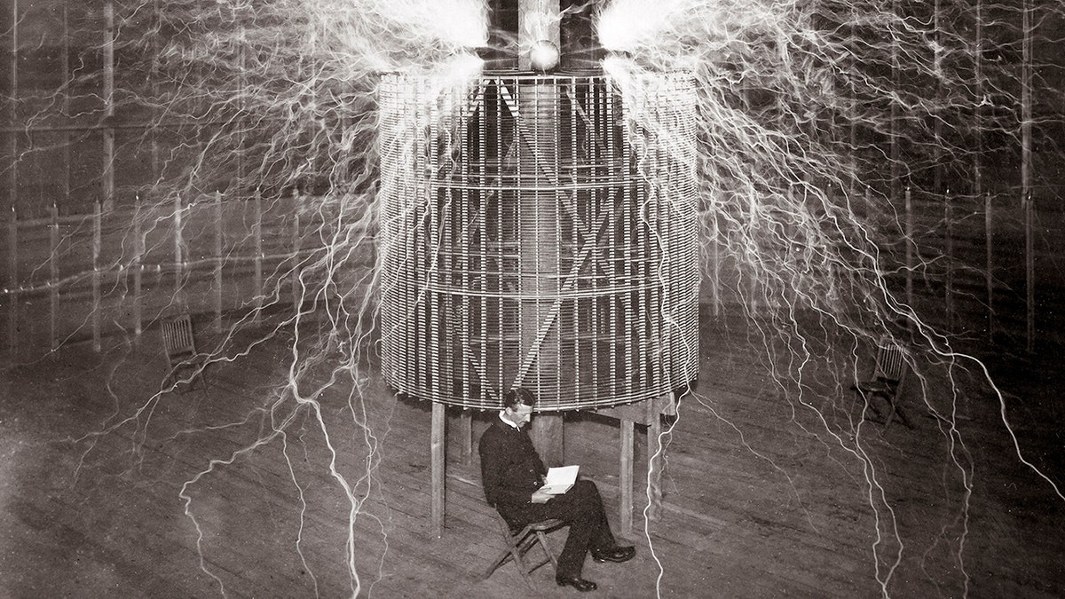 tesla in a lab surrounded by electricity