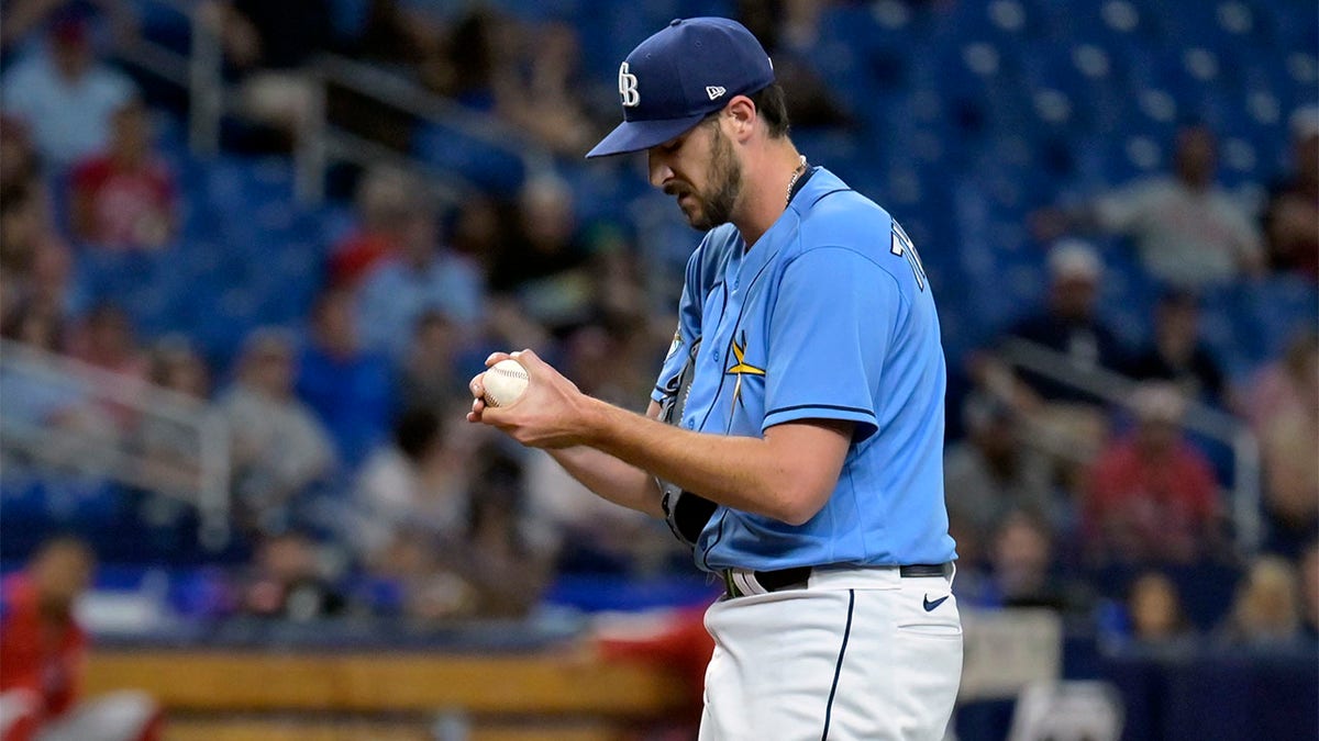 Ryan Thompson rubs up ball