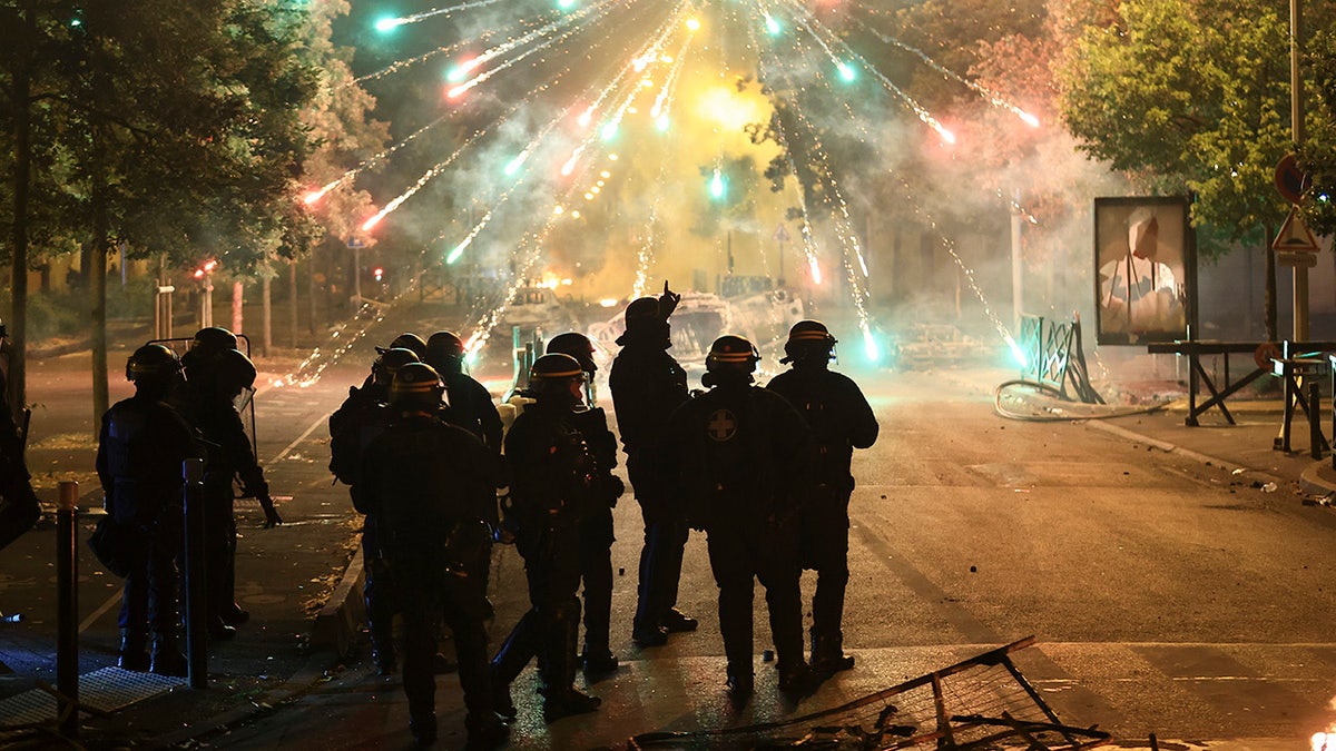 Firecrackers light up the sky over France's riots