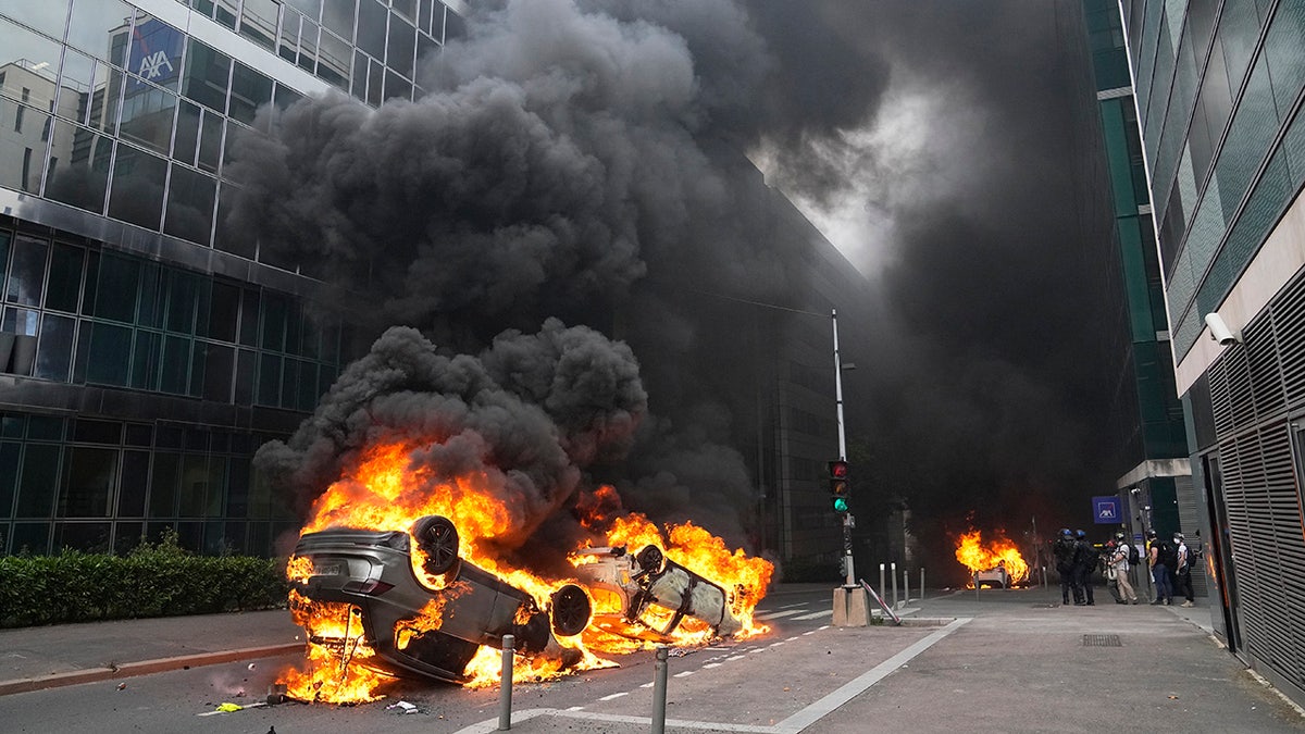 A car set fire in the streets outside Paris