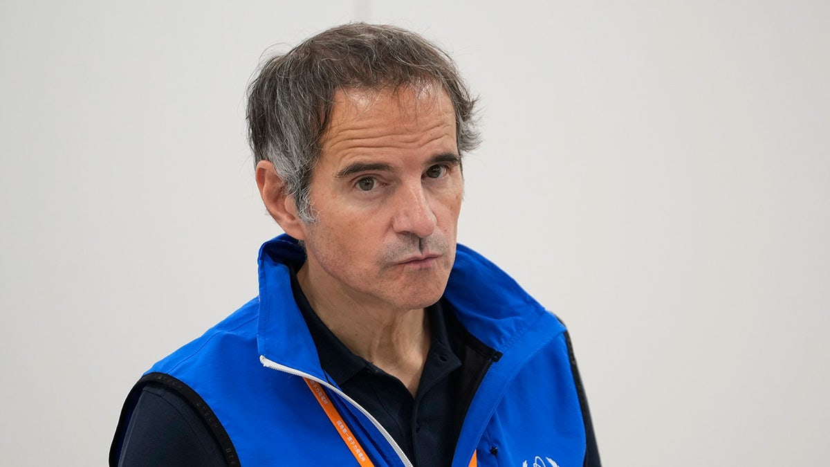 Rafael Mariano Grossi, Director General of the International Atomic Energy Agency, seen in a blue vest taking a reporter's question