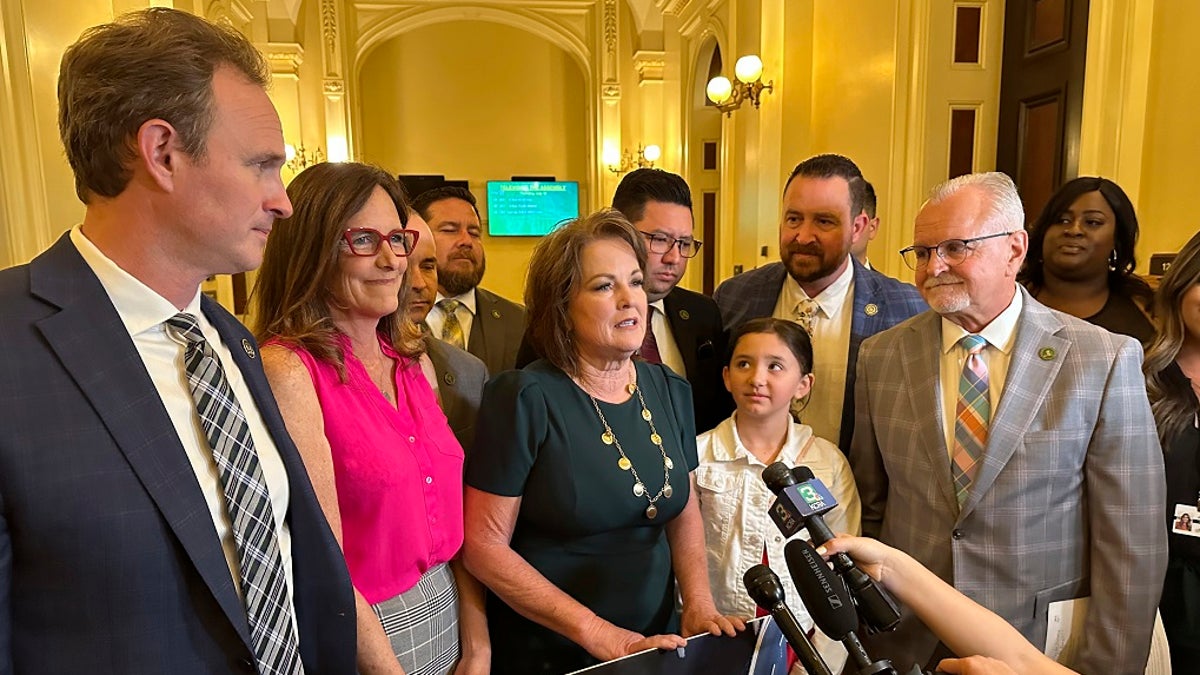 California Republican state Sen. Shannon Grove, center, speaks to reporters in Sacramento in July. A bill Grove authored to increase penalties on child traffickers passed state Legislature on Wednesday. 