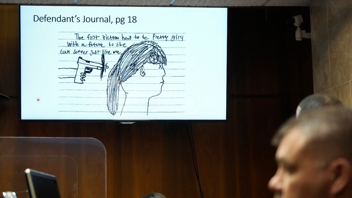 In an image from video, a page from Ethan Crumbley's journal is displayed in court, Thursday, July 27, 2023, in Pontiac, Mich.