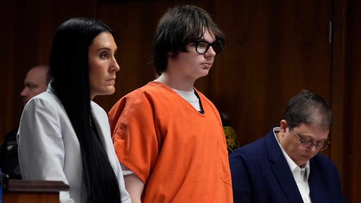 Ethan Crumbley stands with his attorneys Paulette Michel Loftin, left, and Amy Hopp in court, Thursday, July 27, 2023, in Pontiac, Mich.