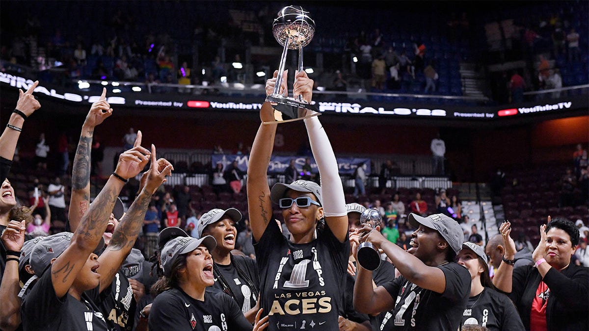 A'ja Wilson holds up trophy
