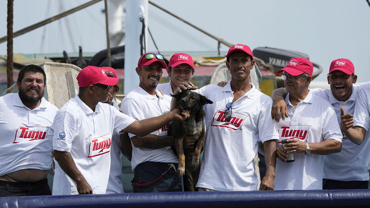 Bella with tuna boat crew