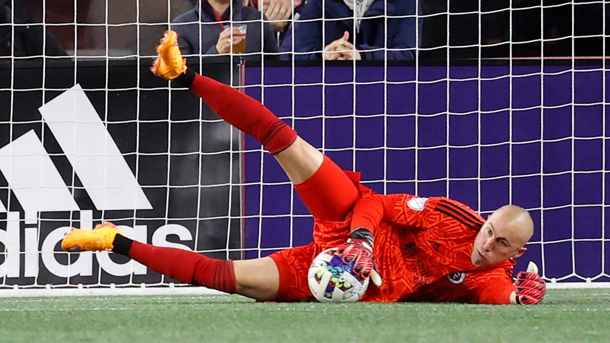 Brad Knighton makes a save during an MLS game