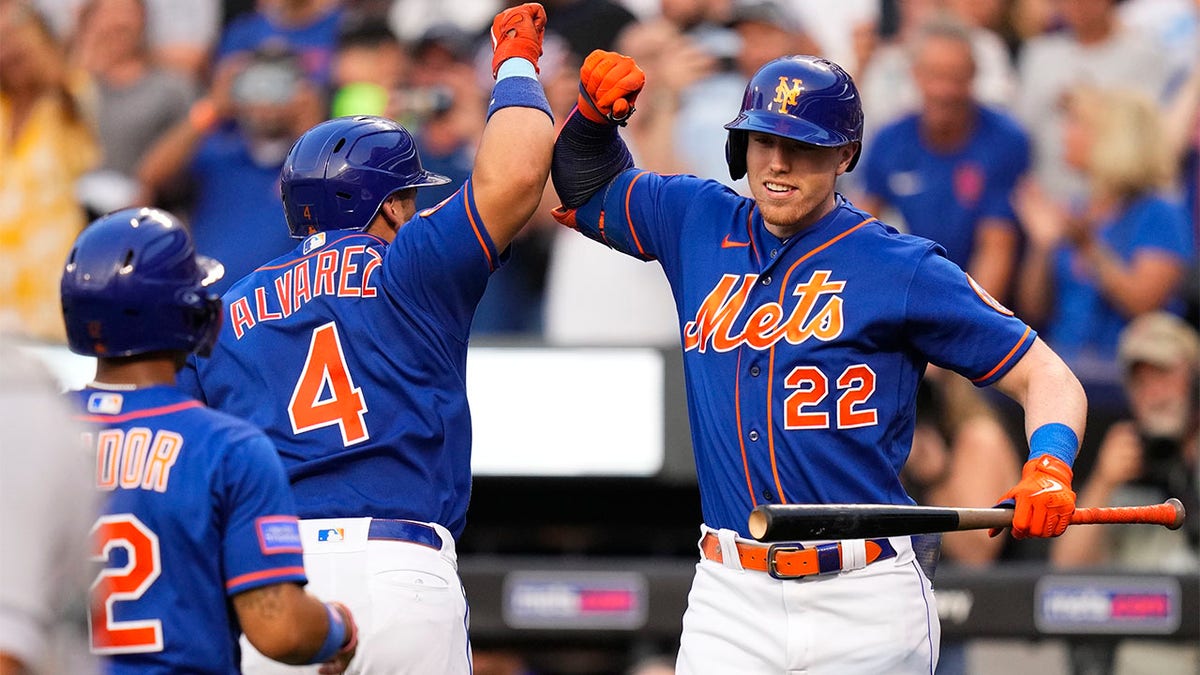 Brett Baty celebrates with Fransisco Álvarez